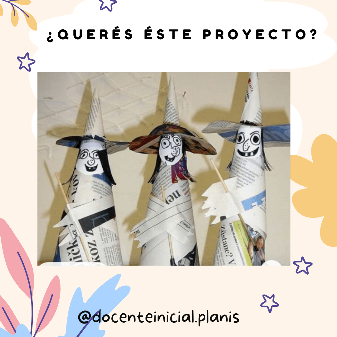 Tres figuras de papel vestidas como brujas Se ven tres conos hechos con papel de diario, cada uno con un rostro dibujado y sombrero puntiagudo. Las figuras están apoyadas frente a una pared clara.